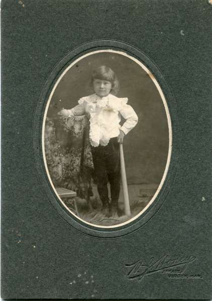 Little Girl Studio Portrait with Bat and Ball